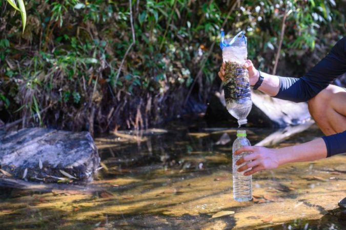 Sand and charcoal water filter with two plastic bottles